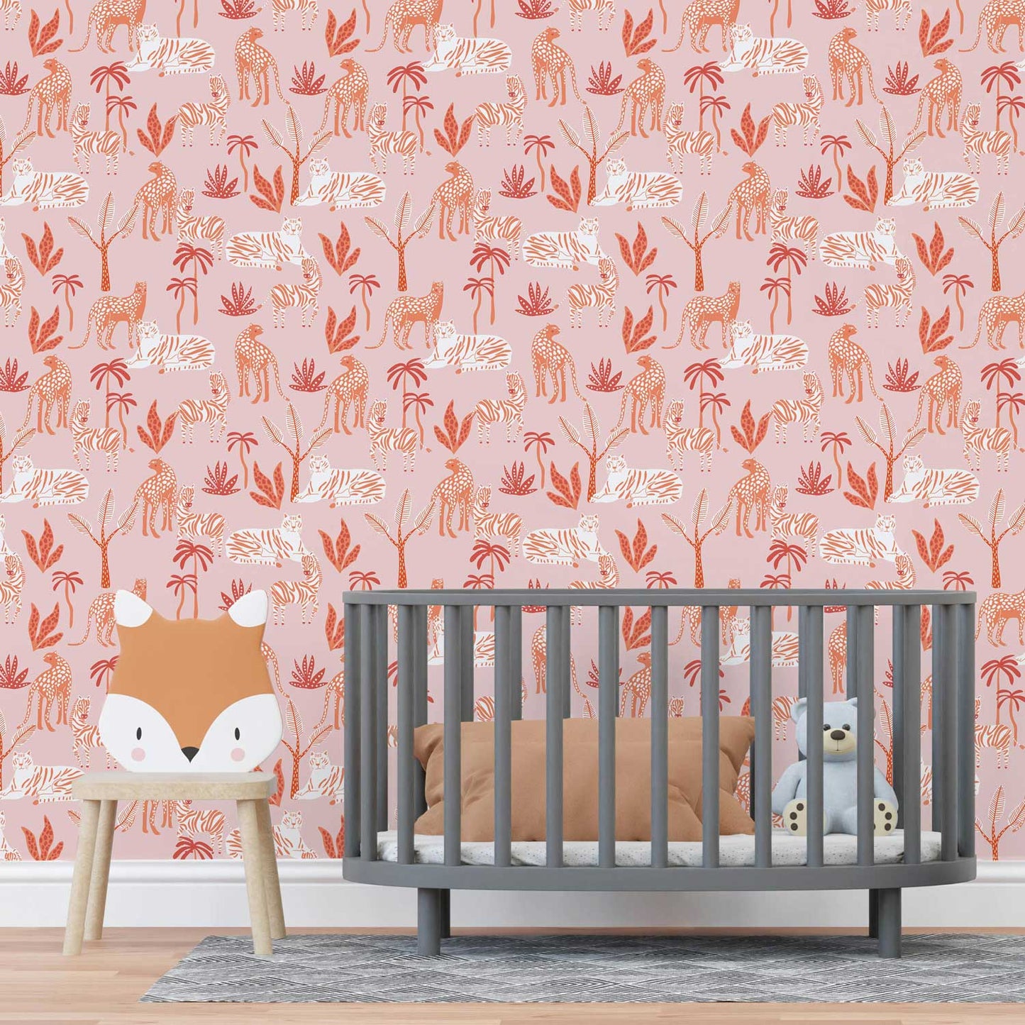 Nursery with dark grey crib and pink tropical wallpaper.