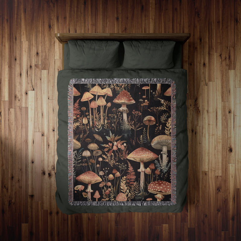 Dark woodland throw with intricate botanical designs