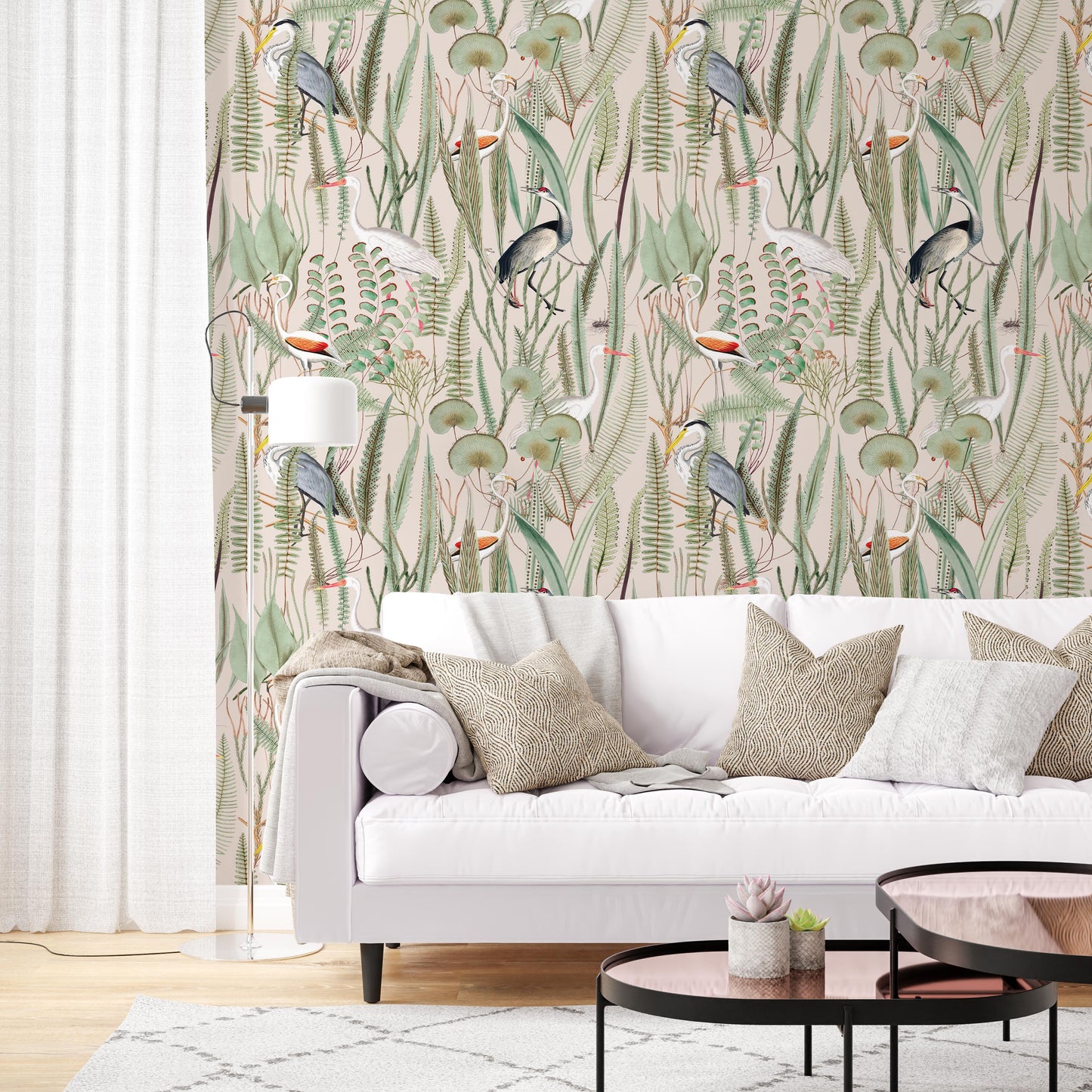 Envision your living room transformed into a tranquil oasis with our captivating pink botanical crane peel-and-stick accent wallpaper. This statement piece features graceful herons amidst a vibrant floral tapestry, creating a breathtaking backdrop for your cozy living room. Complement the wallpaper's romantic hues with a plush white couch and linen interior accents, evoking a sense of serenity and elegance.