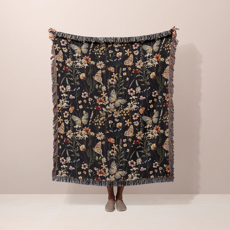 Dark botanical floral throw blanket with butterfly design