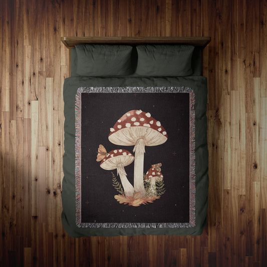 Dark botanical woven blanket with large mushrooms design