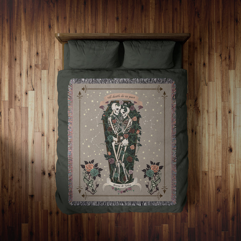 Cozy dark academia-inspired skeleton blanket on a bed