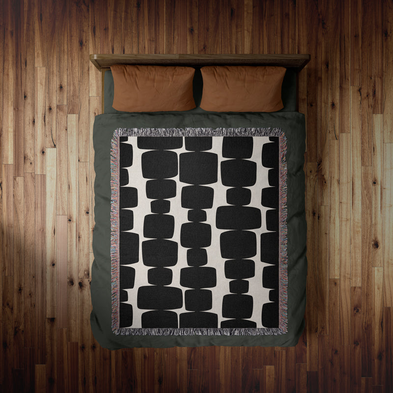 Statement monochrome woven blanket in a bedroom